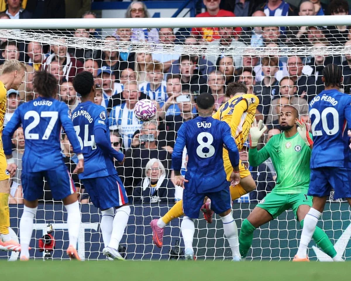 Brighton player scoring against Chelsea during match