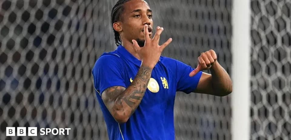 Player celebrating a goal with hand gesture