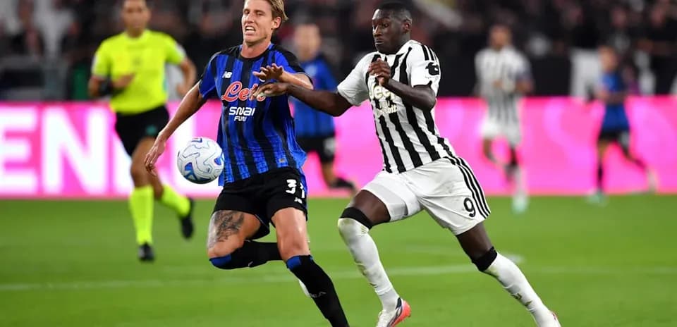 Player contesting the ball during a football match