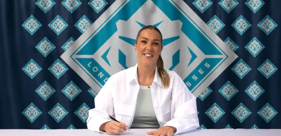 Athlete signing contract at promotional event