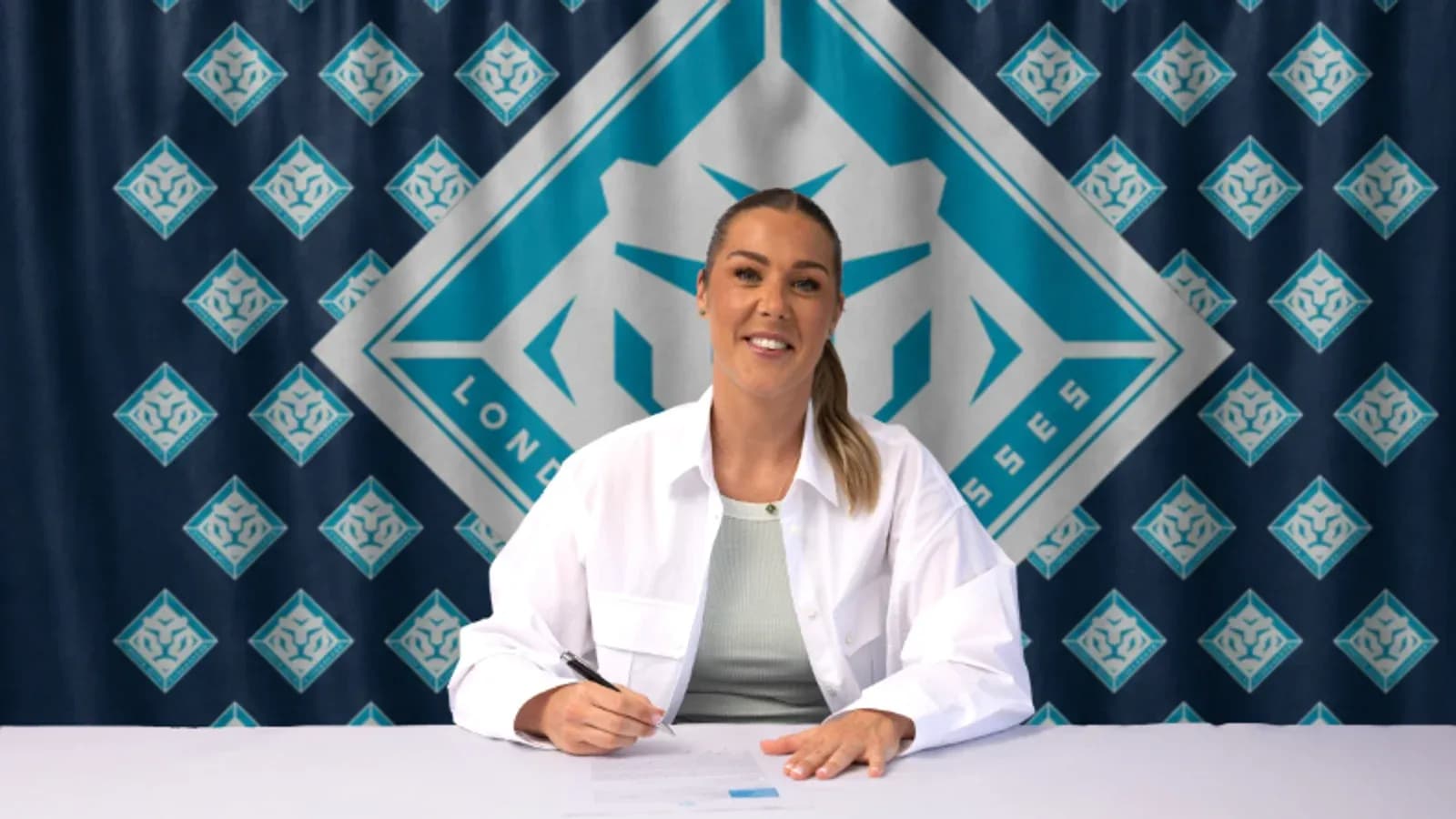 Athlete signing contract at promotional event