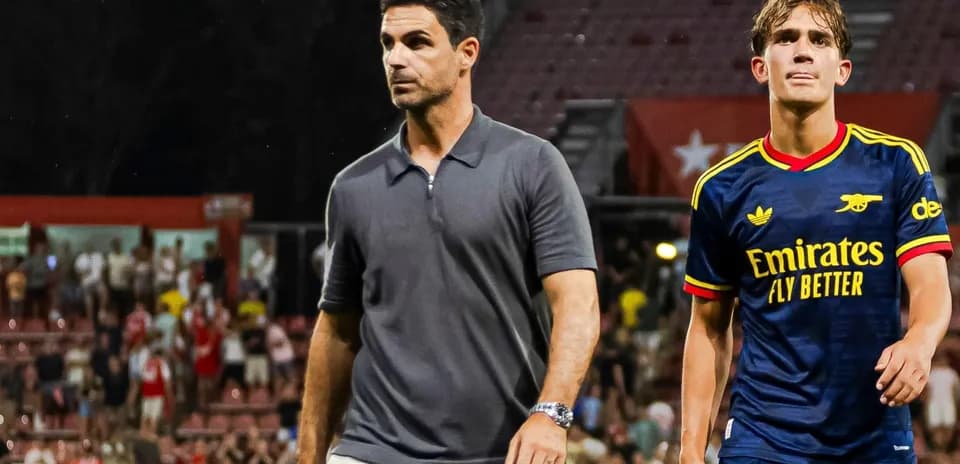 Coach and player walking off the field after match