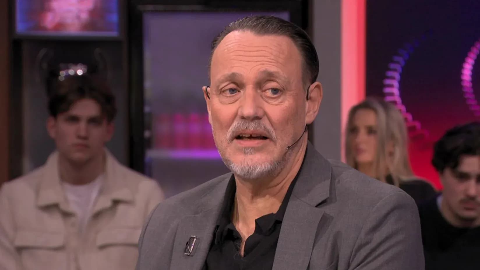 Man speaking during a talk show segment