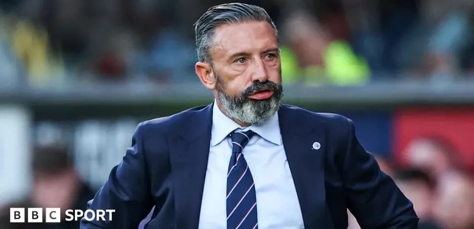Manager observing match from the sidelines