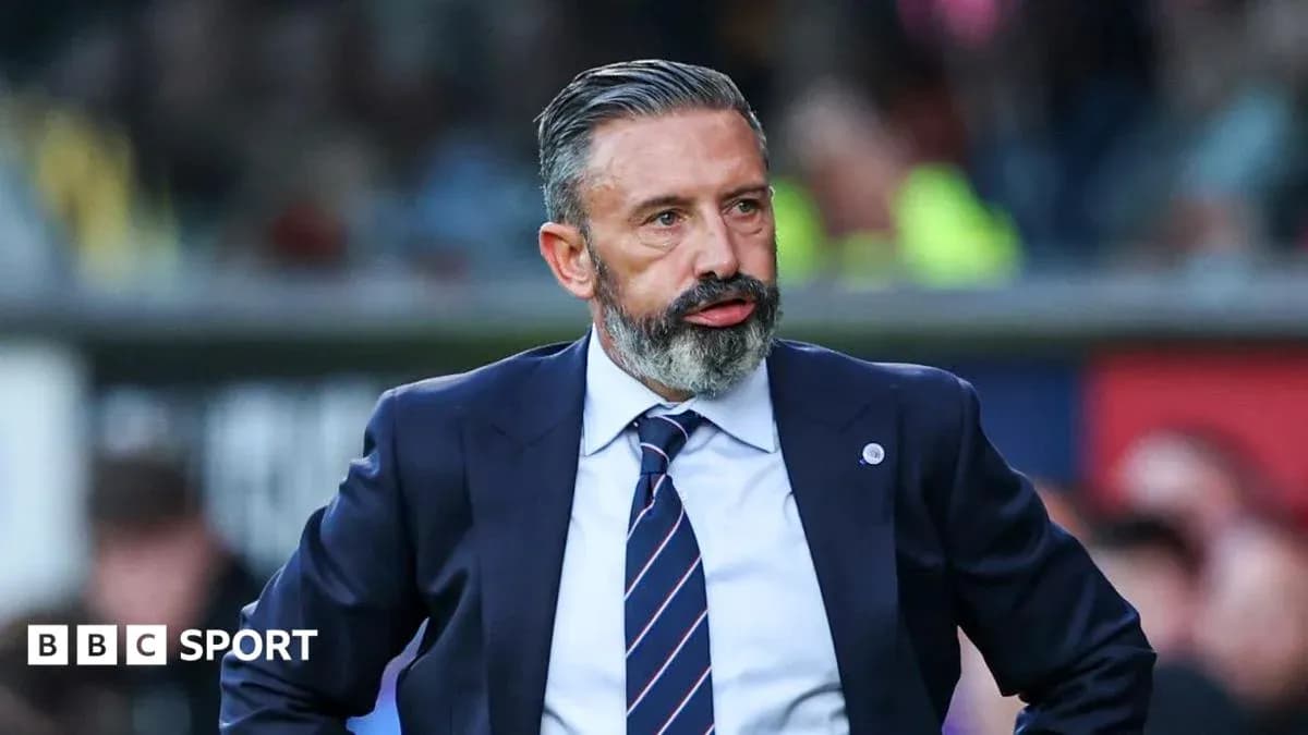 Manager observing match from the sidelines