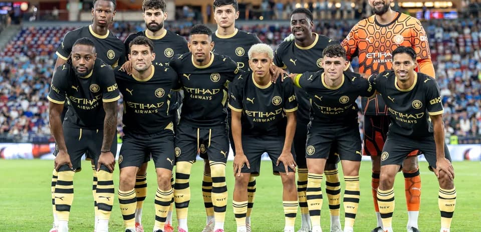 Team posing for photo before match in black kits