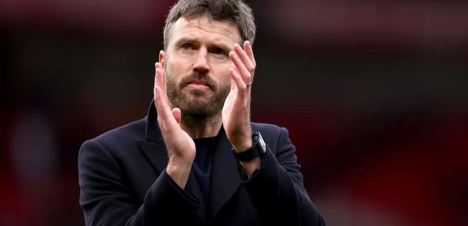 Coach applauding fans during match celebration