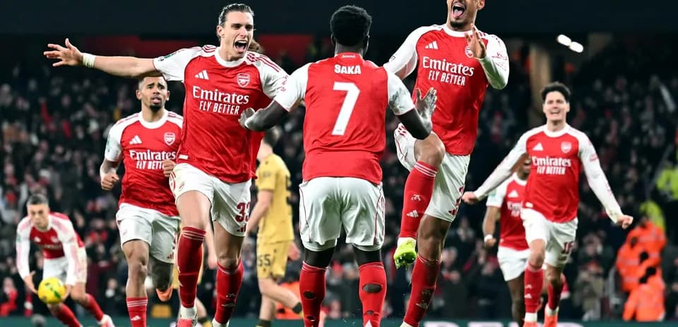 Arsenal players celebrating goal during match