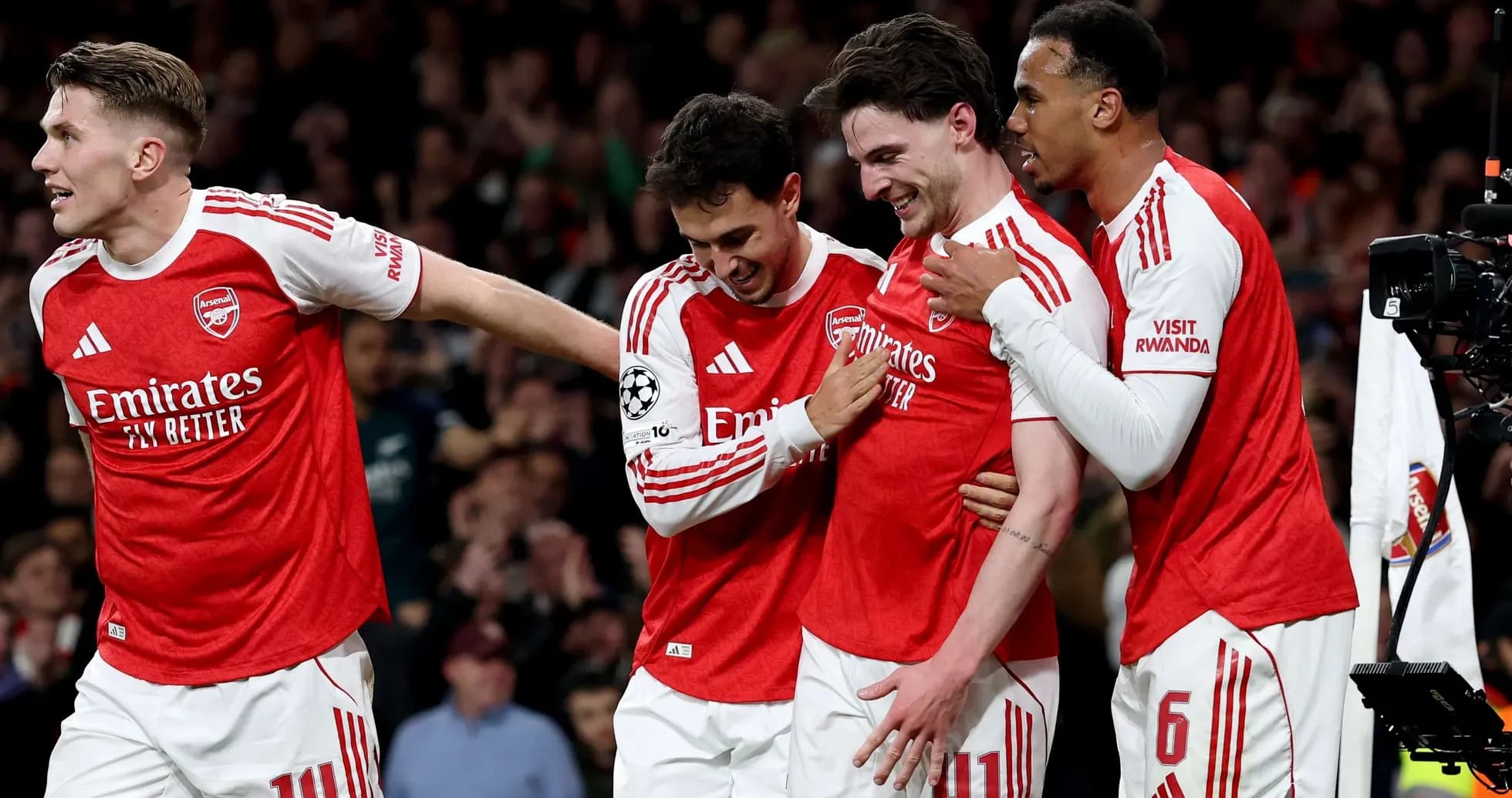 Arsenal players celebrating a goal in Champions League