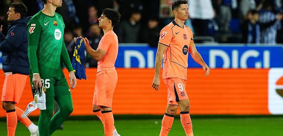 Barcelona players walking off the pitch after match