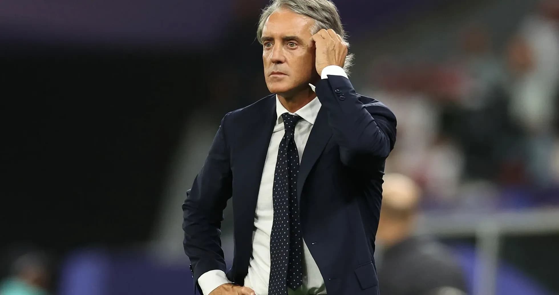 Coach observing the match from the sidelines