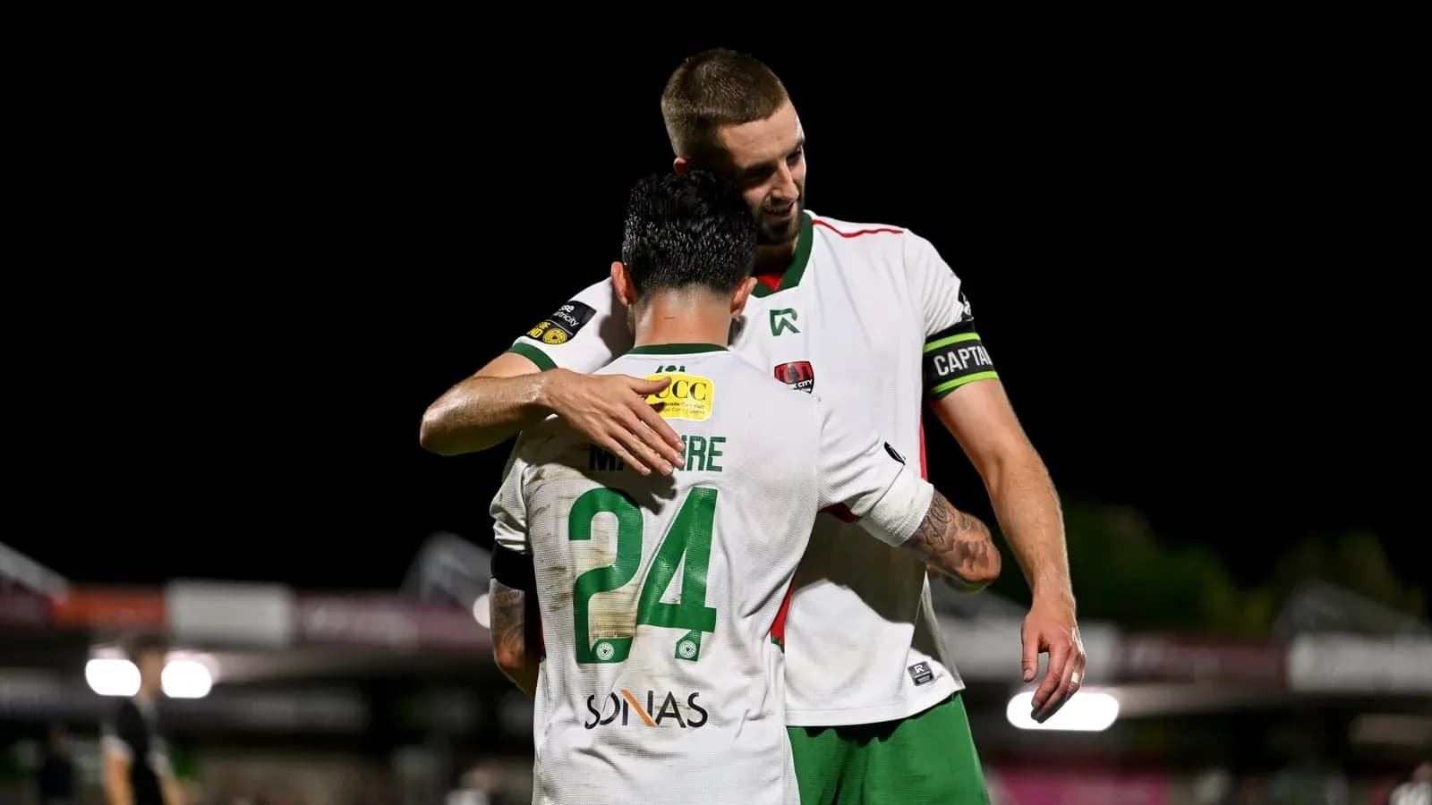 Two players embracing after a match