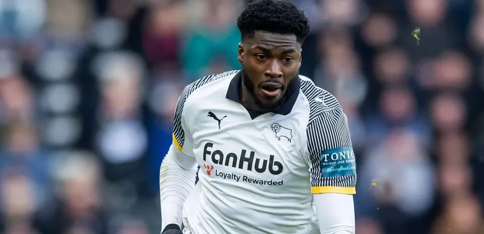 Player in action wearing Derby County jersey