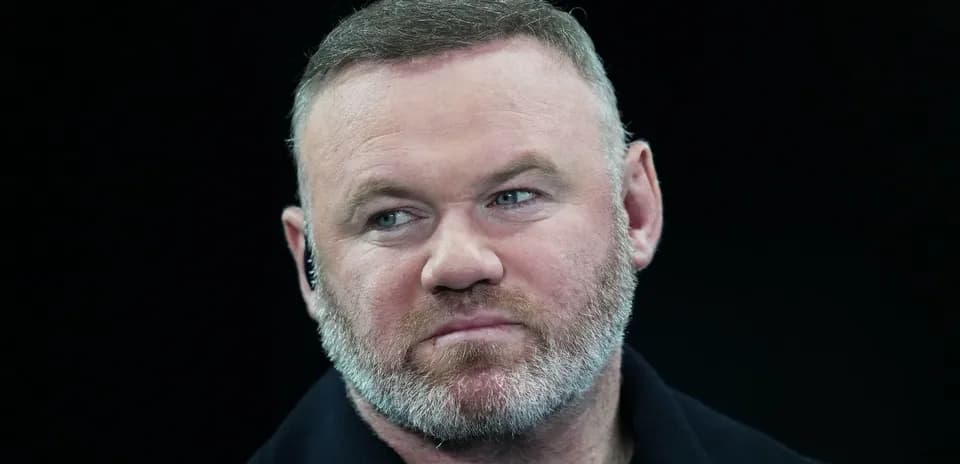 Man with short hair and beard looking forward