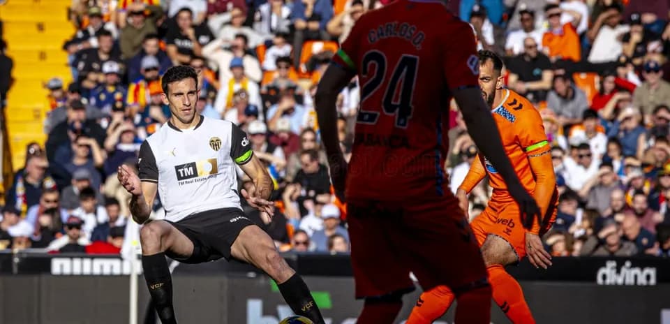Valencia player in action against Celta Vigo