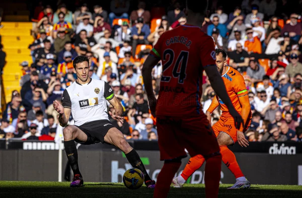 Valencia player in action against Celta Vigo