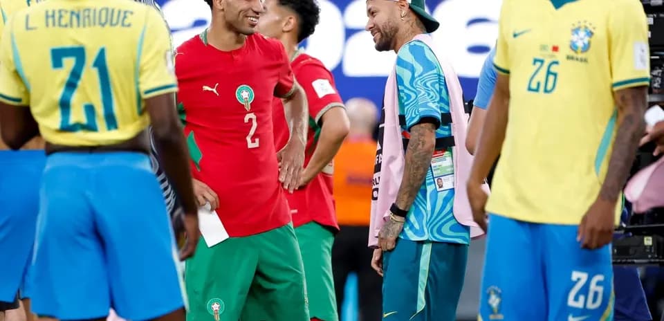 Players from Morocco and Brazil chatting post-match