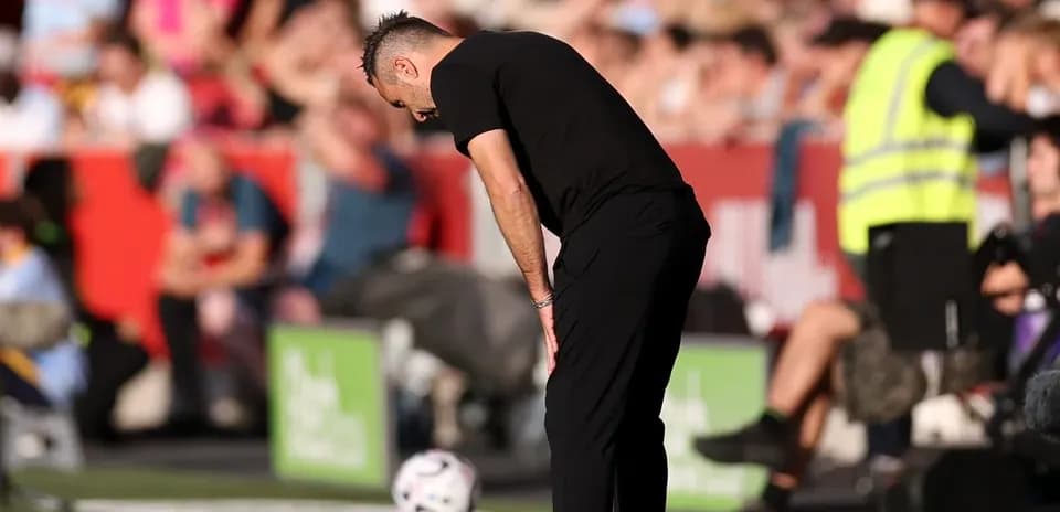 Coach observing the game from the sidelines