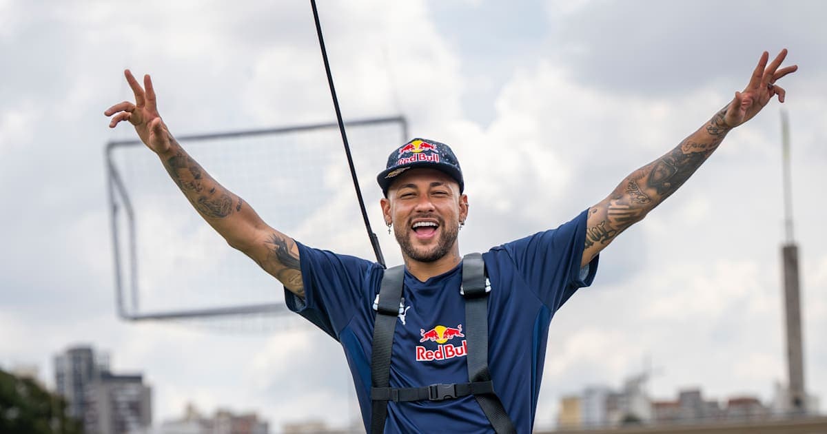 Neymar celebrating with arms raised outdoors