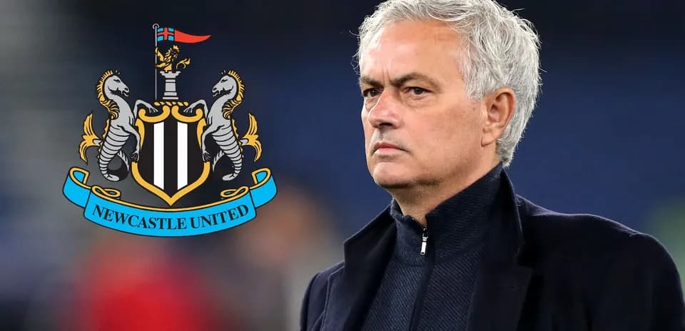 Coach standing with Newcastle United logo in background