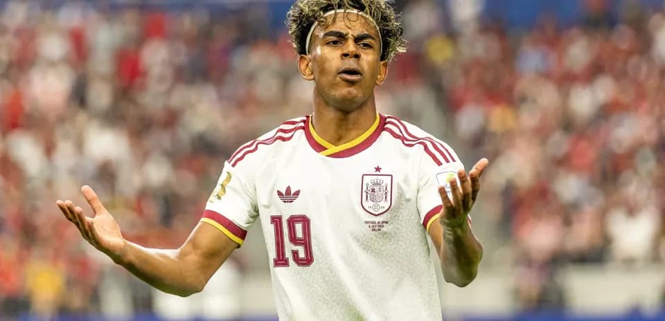 Player gesturing during a match wearing Spain jersey