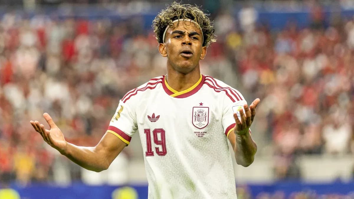 Player gesturing during a match wearing Spain jersey