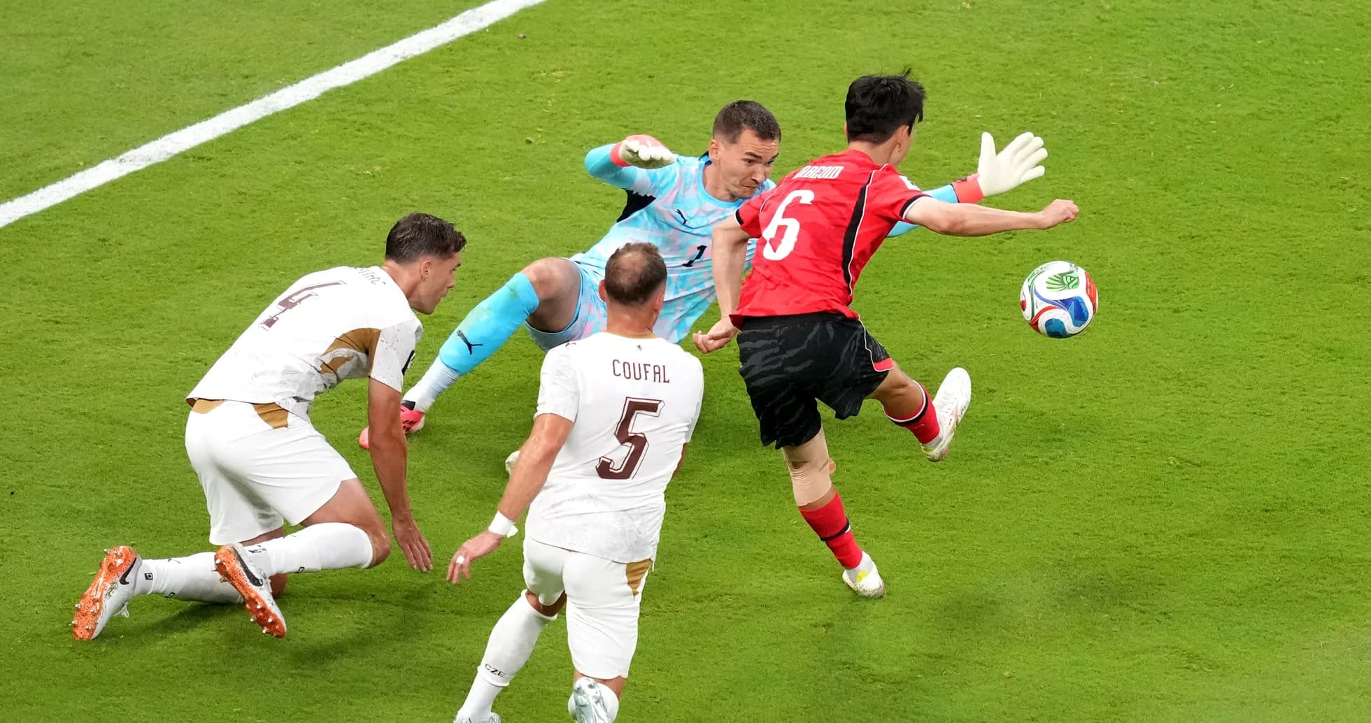 South Korea player shoots at goal against Czech Republic