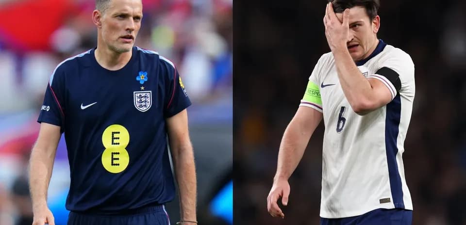 Two England players during a match, one in distress