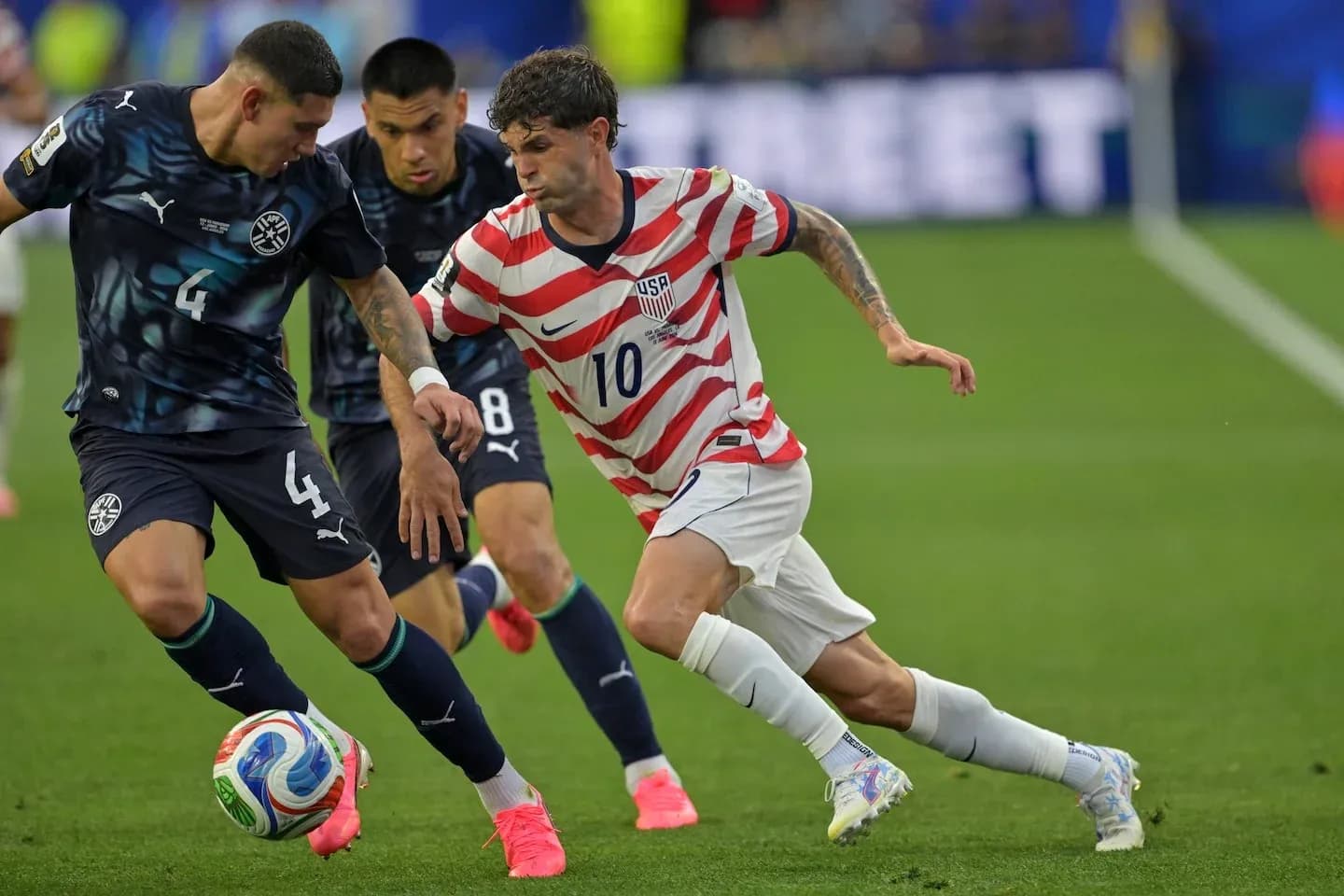 Player with ball evading tackle from opponent during match
