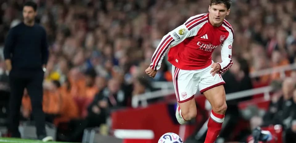Arsenal player taking a throw-in during match