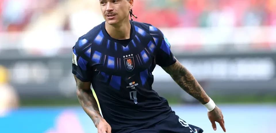 Player in dark jersey running on the field