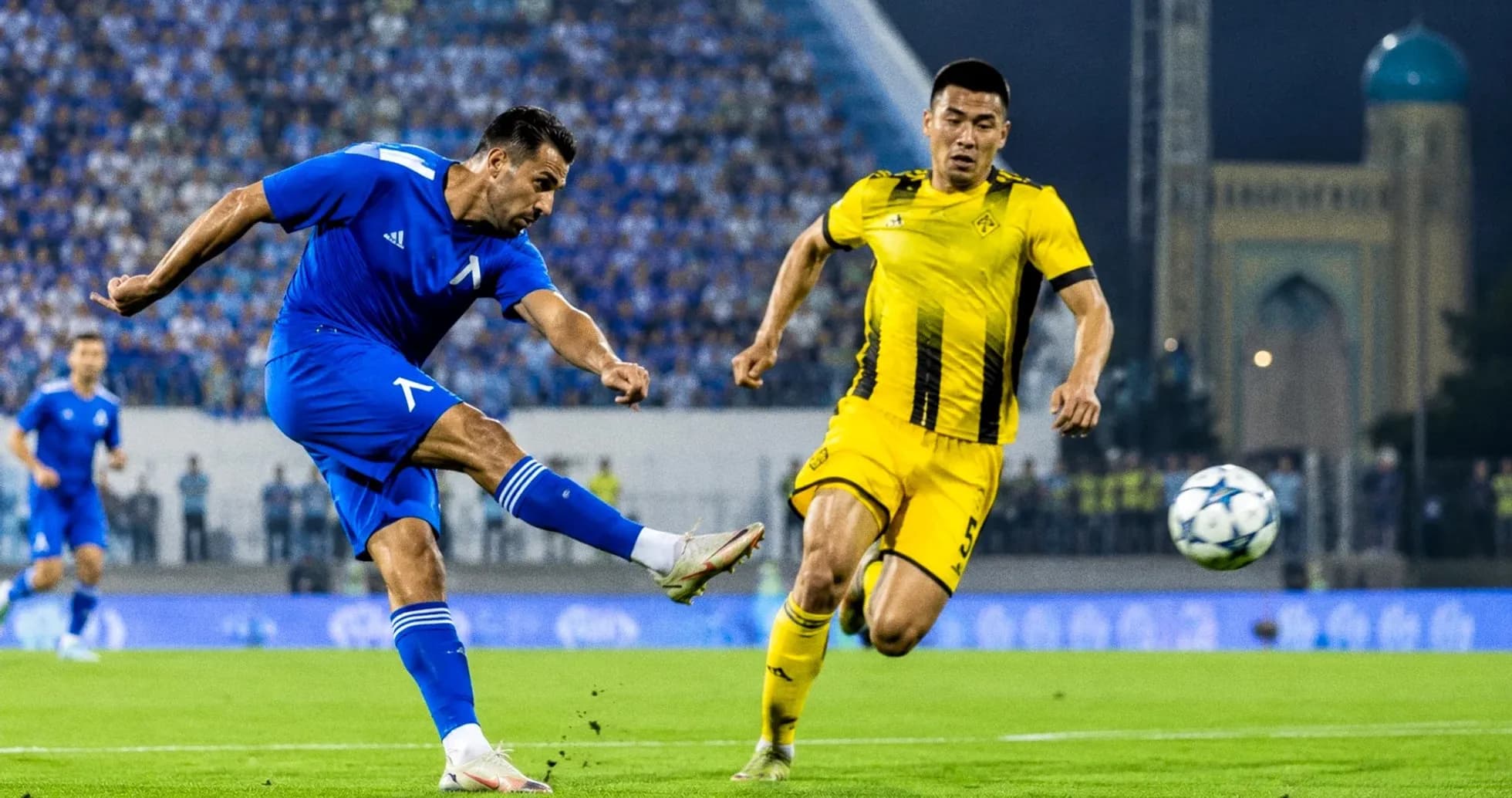 Player kicking ball during UEFA Champions League match