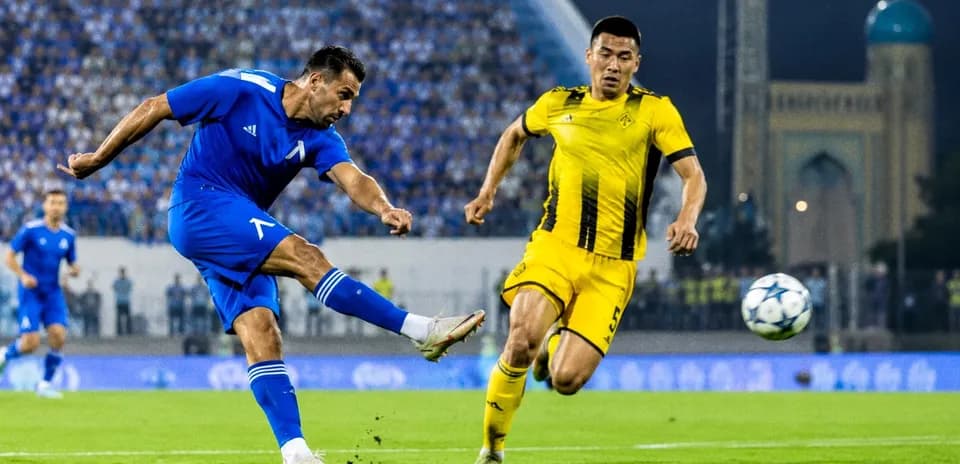 Player kicking ball during UEFA Champions League match