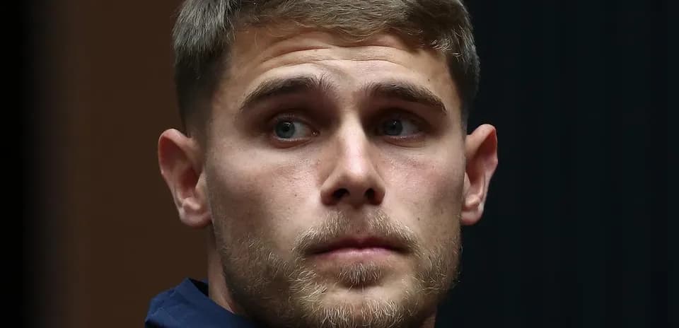 Player in Tottenham jacket during event
