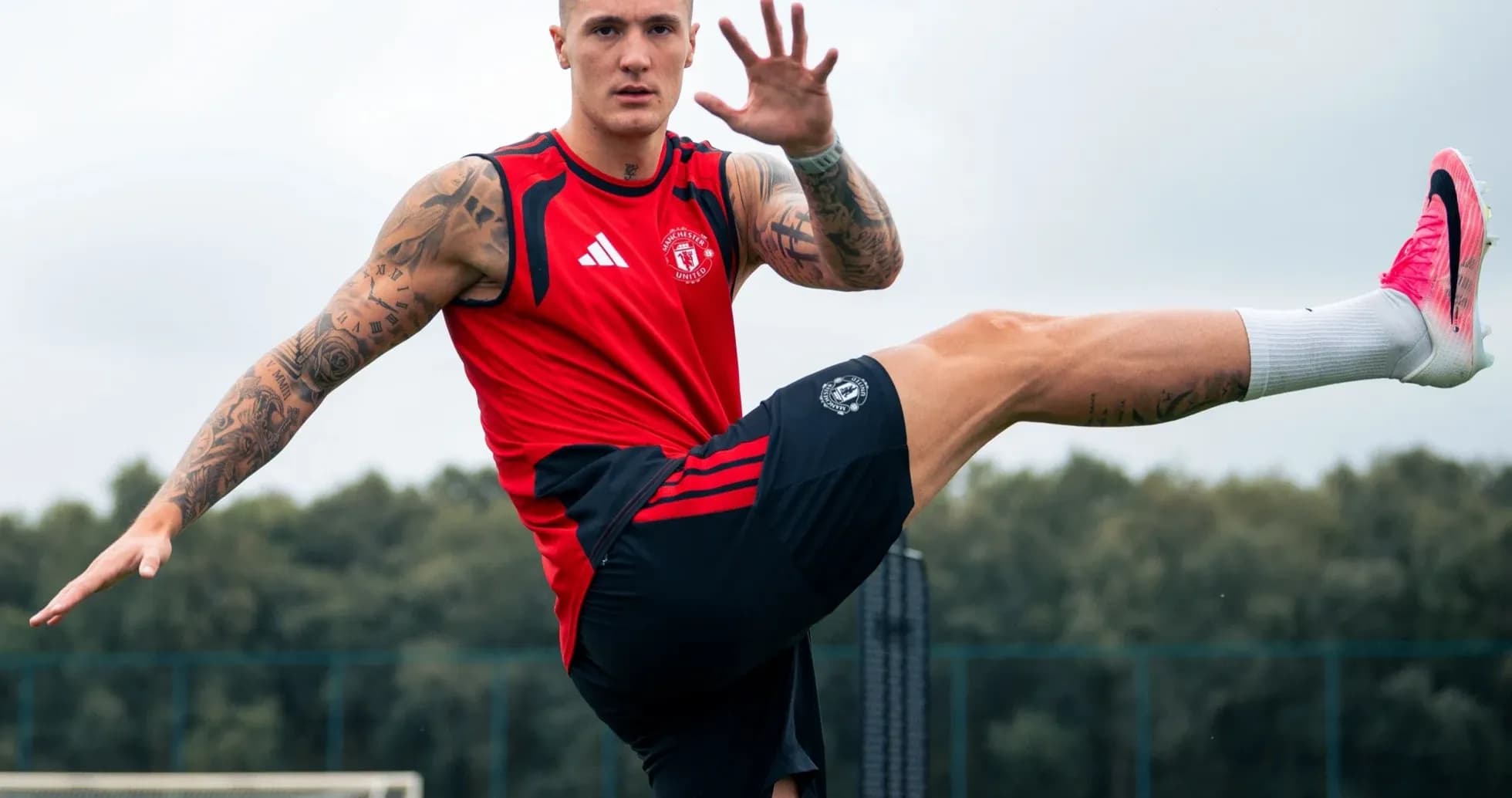 Player training with high kick on practice field