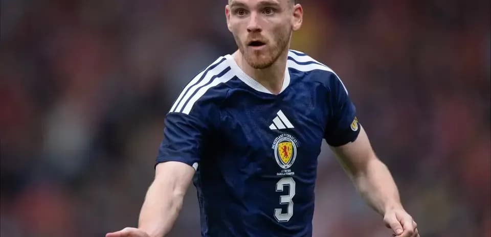 Scotland player gesturing during football match