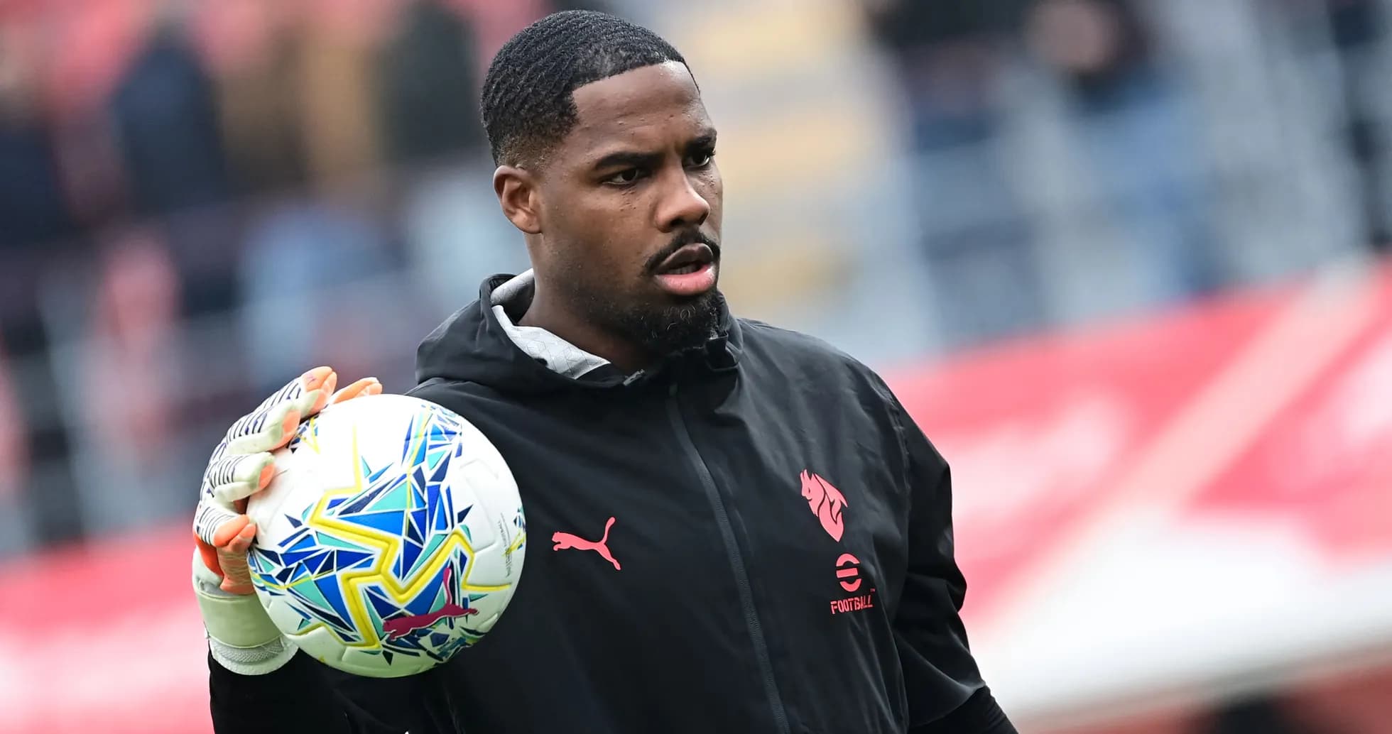 Goalkeeper holding ball before match warm-up