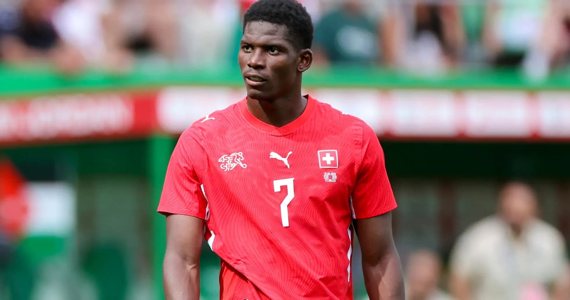Player in red jersey during football match