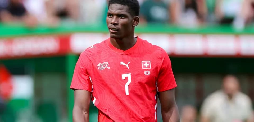 Player in red jersey during football match