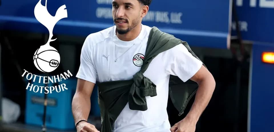 Player walking towards team bus in training gear