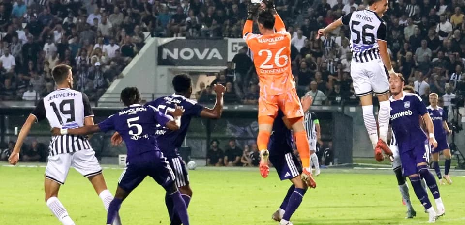 PAOK goalkeeper catching the ball during match