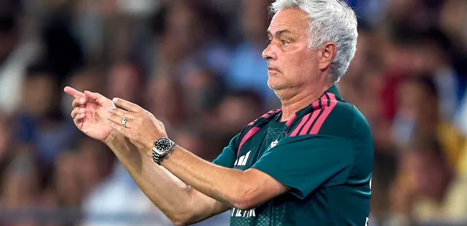 Coach giving tactical instructions during match