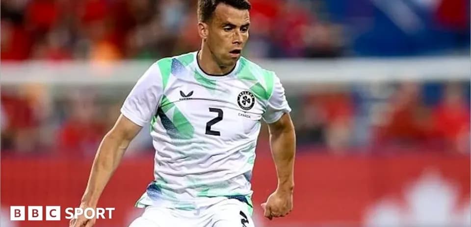 Player in action wearing green and white jersey