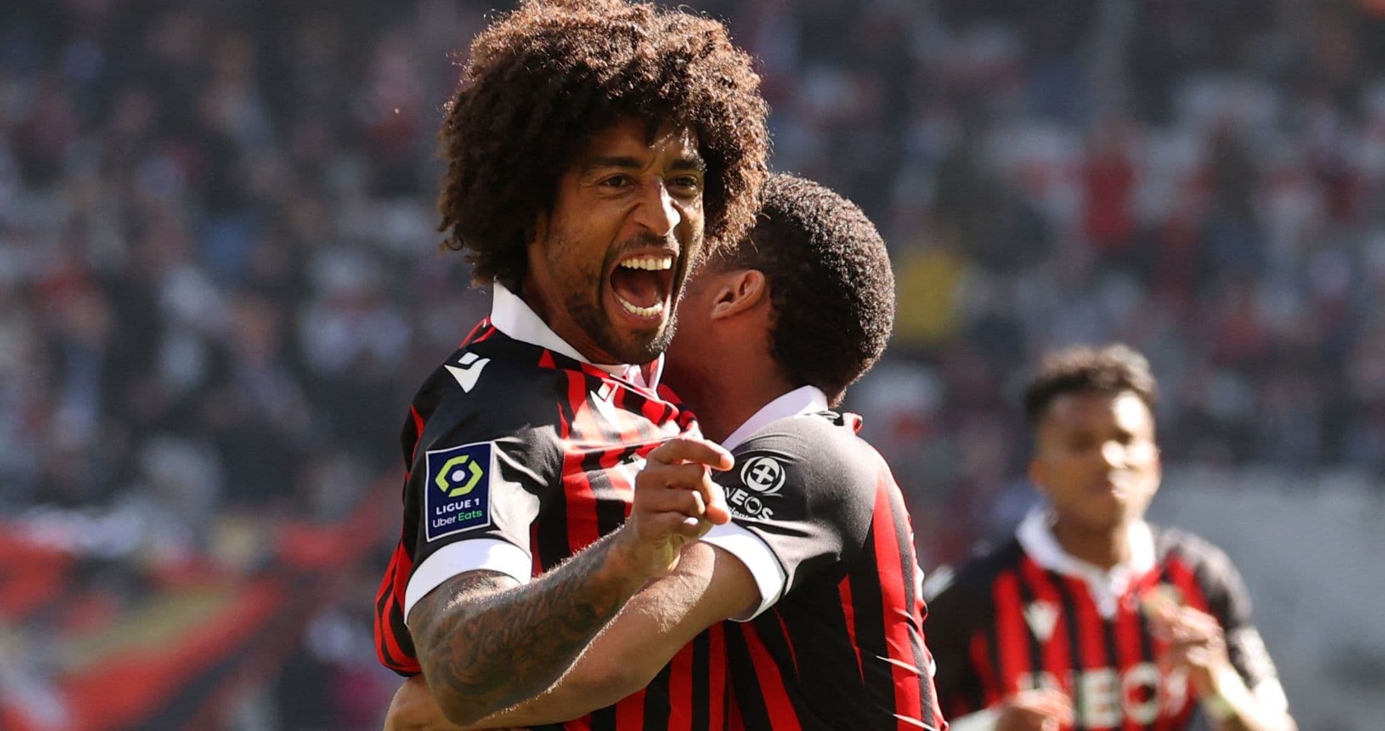Player celebrating goal with teammate during match