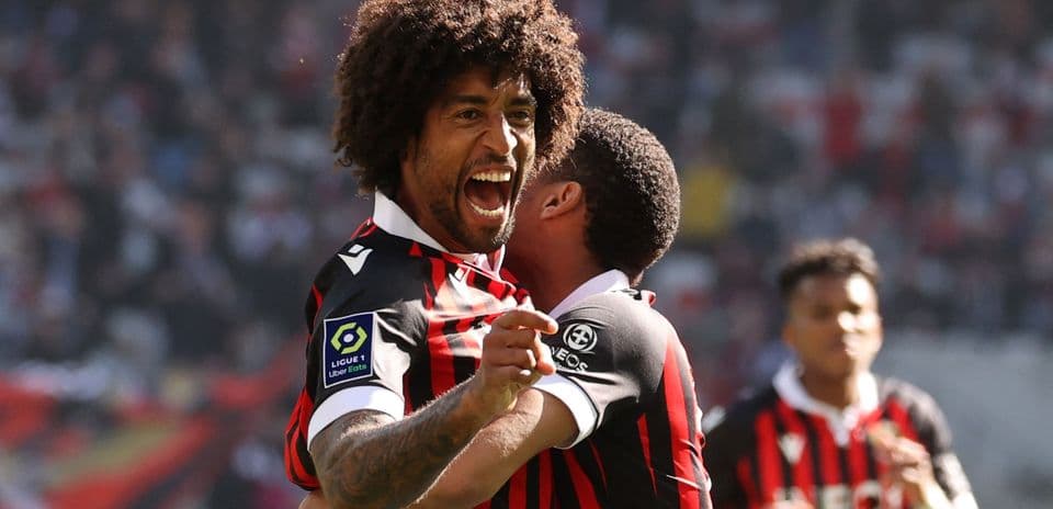 Player celebrating goal with teammate during match
