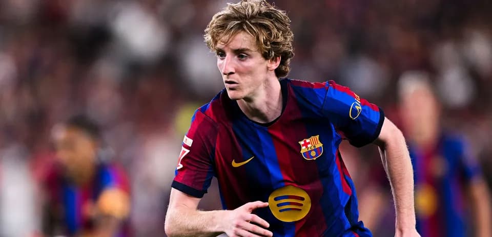 Player in FC Barcelona jersey running on the field