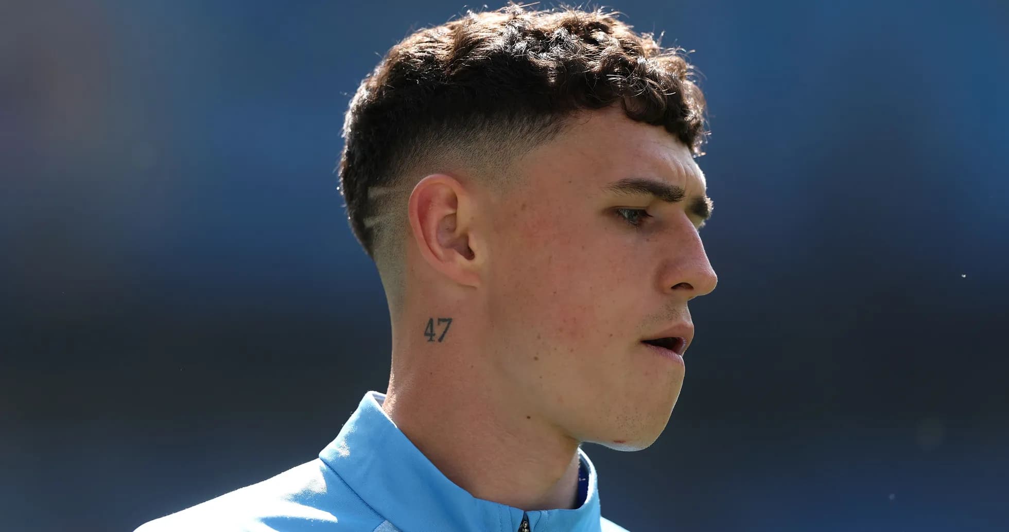 Player with tattoo on neck during warm-up