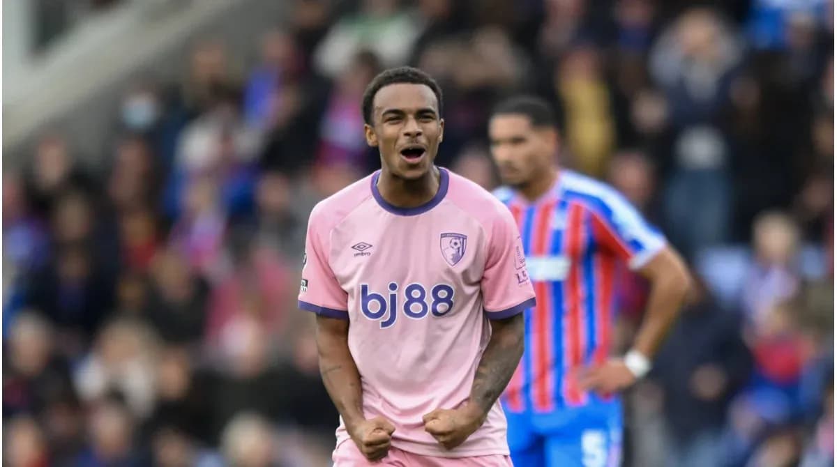 Player celebrating during match in pink jersey
