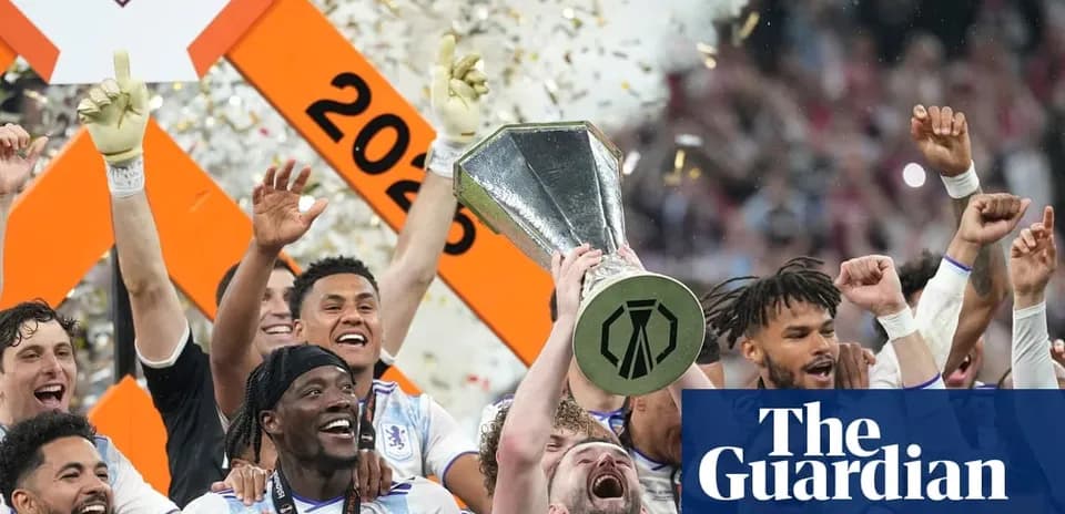 Players celebrating with trophy after winning championship