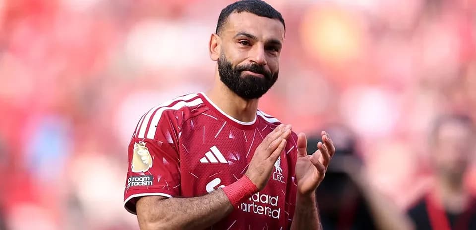 Player applauding fans during a match at Anfield